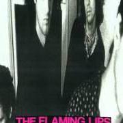 Il testo GOD WALKS AMONG US NOW - JESUS SONG NO. 6 dei THE FLAMING LIPS è presente anche nell'album In a priest driven ambulance (1990)