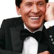 Il testo QUESTO GRANDE PASTICCIO di GIANNI MORANDI è presente anche nell'album L'amore ci cambia la vita (2002)